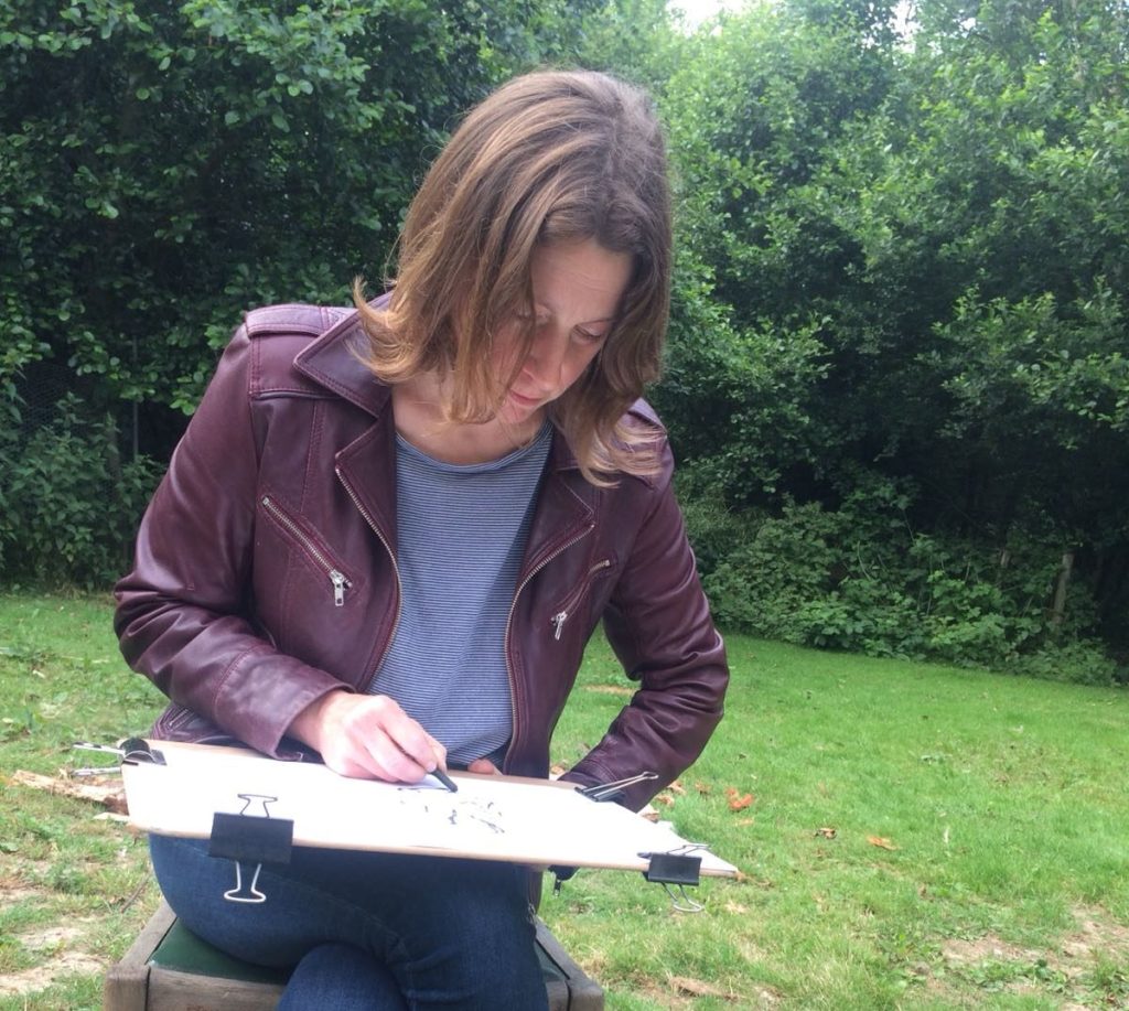 Author shown drawing en plein air
