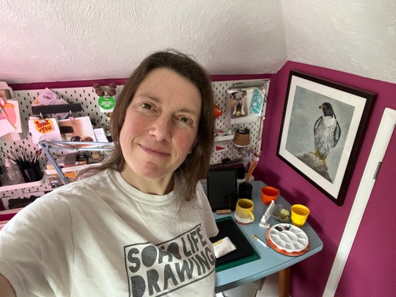 Photo of the author with art studio in the background